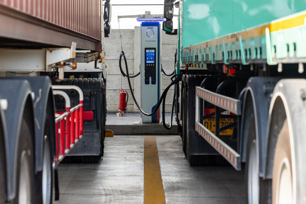 EV semi-truck refueling at an industrial power hub.
